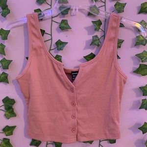 Crop top shirt that has a low neckline with buttons